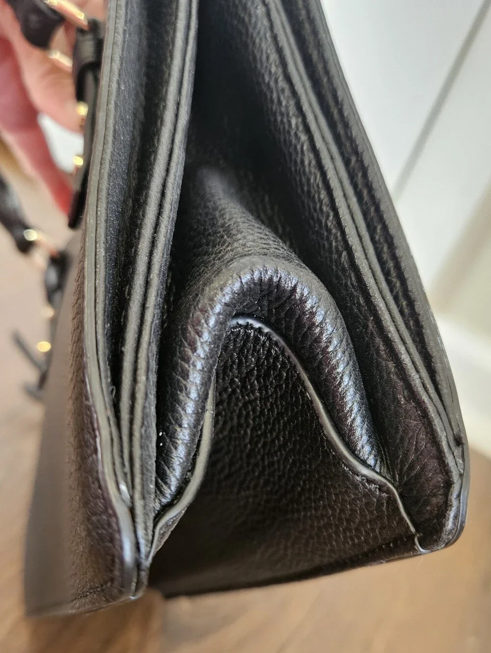 kate spade black pebbled leather satchel with gold accents
